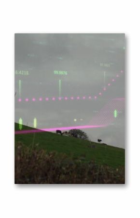 Wind turbine standing on farmland, with grazing cattle, hedgerow and digital overlay, copy space