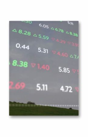 Featuring field with wind turbine on green hill, overlaying digital red and green stock numbers