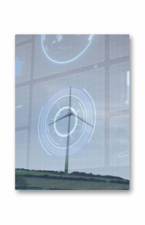 Spinning tall white wind turbine on green hedged hillside, with translucent panels showing charts