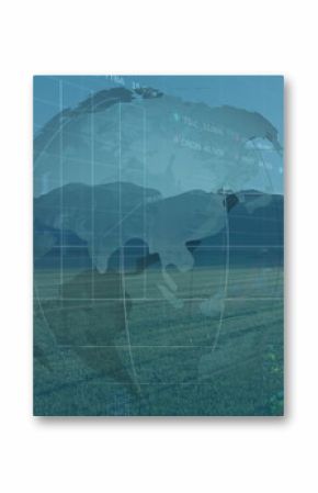 Floating semi-transparent digital globe featuring grid overlay above farmland, with wind turbines