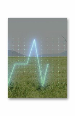 Pulsing ECG waveform spanning grassland wind farm, with digital grid overlay and wind turbines