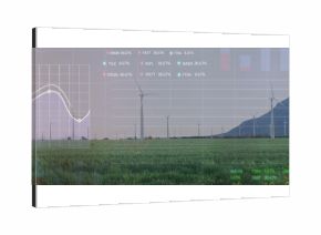 Displaying grassy field stretching to wind turbines at mountain base wind farm, with data charts