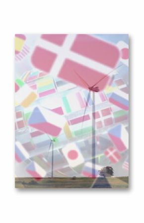 Spinning wind turbine rotating blades on grassy plain, blending global flag graphics, copy space
