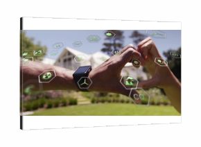 Forming heart shape with couple's hands in front yard, with smartwatch and renewable energy icons