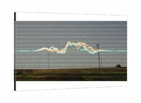 Looming wind turbine rising over grassy plain, with grid, line graph, numeric labels, copy space