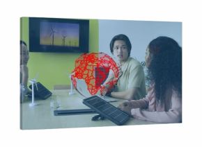 Reviewing renewable energy models, team wearing suits collaborating in boardroom with globe graphic