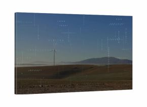 Standing white wind turbines spanning ridge on rural plains, showing valley fog and binary overlay