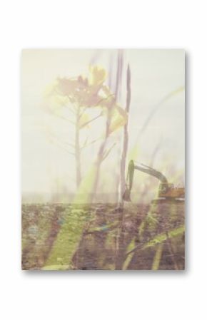 Summer grass over digger in rubbish disposal site