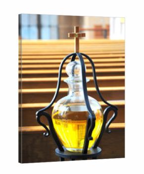 Cross and anointing oil inside a church.