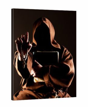 Mystery preaching monk with bible