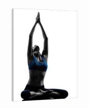 woman exercising yoga meditating sitting hands joined