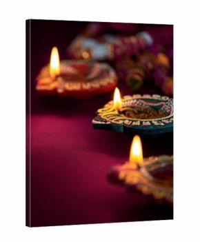 Colorful clay diya lamps lit during diwali celebration
