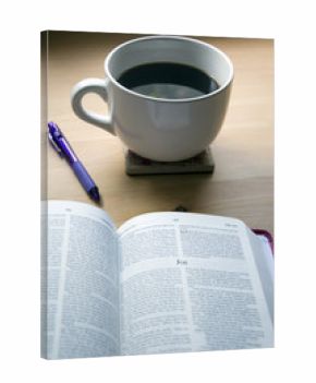 coffee cup and pen for bible study on desk