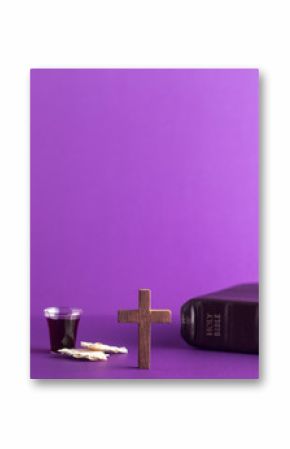 Symboles of Christianity and the Communion on a Purple Background