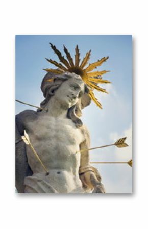 Saint Sebastian shot with arrows martyr statue, Marian plague column of Saint Rosalia, Velehrad Monastery, Moravia, Czech Republic, sunny day clear blue sky