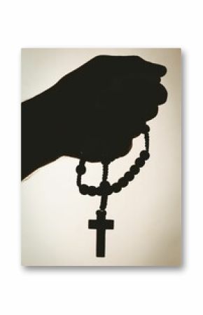 Hand holding rosary beads