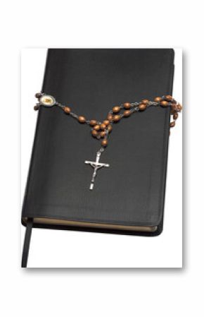 Close-up of bible with rosary beads 