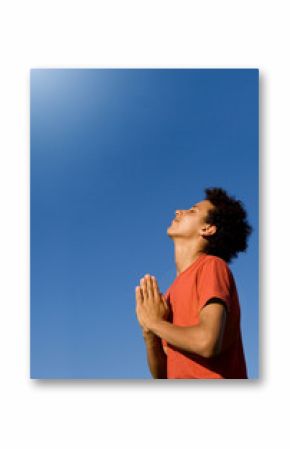 happy christian boy praying with joy