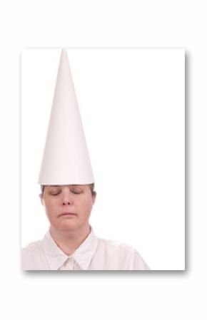 Woman in a dunce cap with eyes closed over a white background