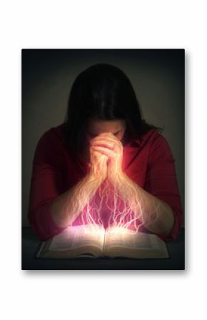 Woman prays over a Bible