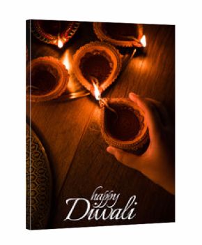 Happy Diwali greeting card design using Beautiful Clay diya lamps lit on diwali night Celebration.  Indian Hindu Light Festival called Diwali, a festival of light    