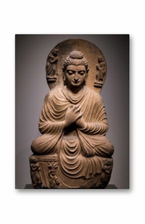 ancient seated Buddha schist statue image in 2nd-3rd century, Kushan dynasty from Gandhara, Pakistan.