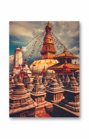 The famous Buddhist stupa at Boudanath in Kathmandu valley, Nepal. Was built in the 14th century. Blue cloudy sky in the background. Travel, holiday. Vintage retro toning filter orange color
