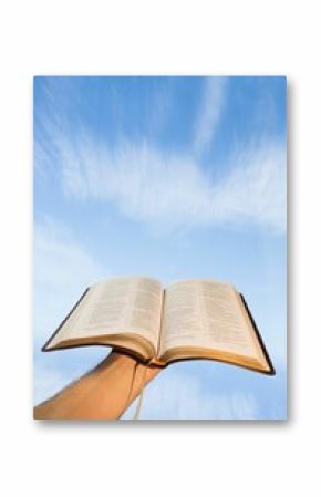 Low angle view of hand holding open Bible