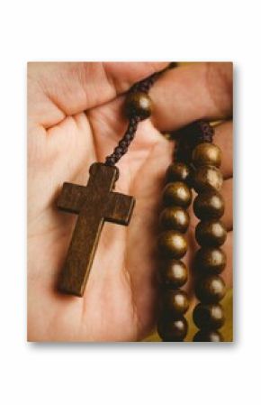 Hand holding rosary beads