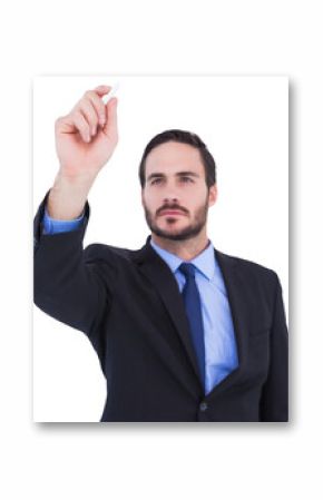 Businessman holding a chalk and writing something