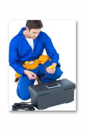 Electrician using multimeter over white background
