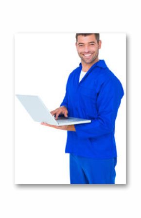 Happy mechanic using laptop on white background