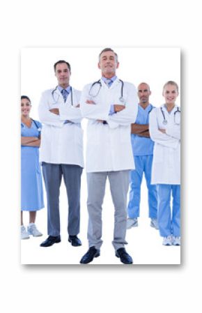 Portrait of confident doctor with team