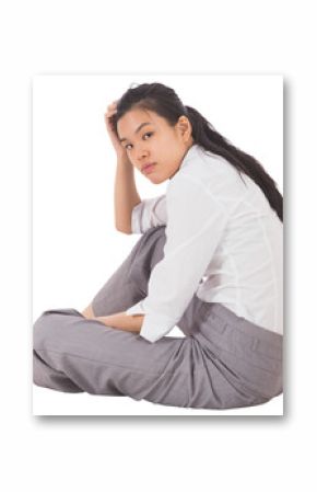 Depressed businesswoman sitting with hand on head