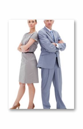 Serious businessman standing back to back with a woman 