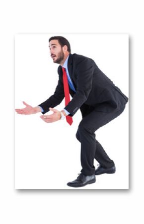 Bending businessman holding hand out while looking up