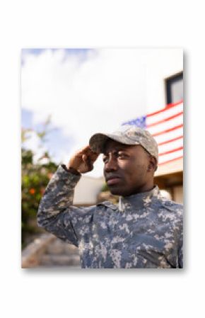 Young African American soldier in military uniform saluting with pride