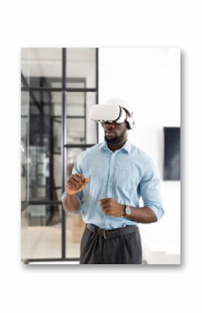 Using VR headset, businessman exploring virtual reality in modern office environment