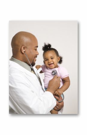 male pediatrician examining baby girl.