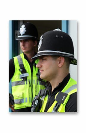 Two British Police Constables in uniform standing together