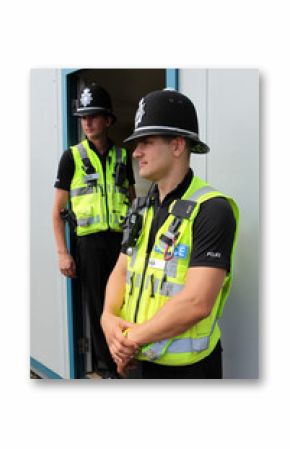 Two British Police Constables in uniform standing together