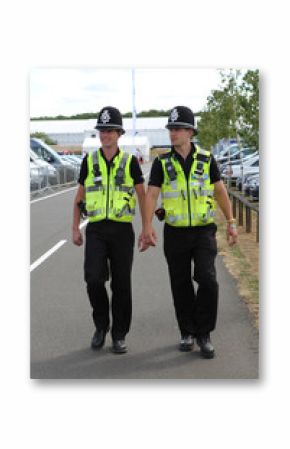 Two British Police Constables on patrol and in uniform