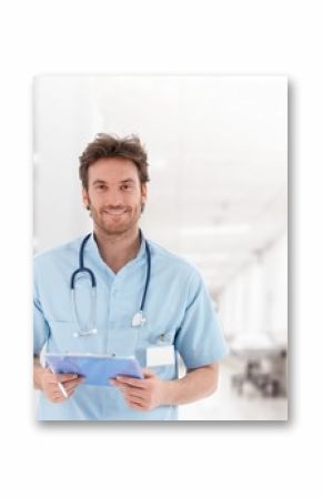 Handsome young doctor on hospital corridor