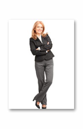 Full length portrait of a smiling businesswoman leaning on wall