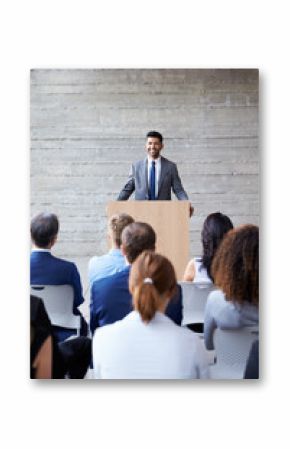 Businessman Addressing Delegates At Conference