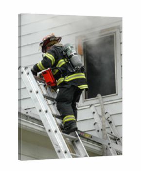 Firefighter climbing ladder