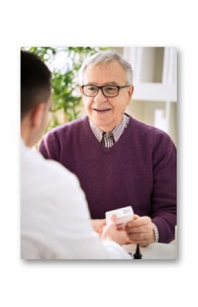 Medical doctor consulting senior patient