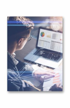 Young businessman analyze stock report on notebook screen.Concept of digital screen,virtual connection icon,diagram,graph interfaces on background.Vertical.