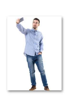 Happy successful businessman taking selfie looking at smart phone. Full body length portrait isolated over white background.