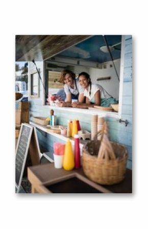 Portrait of waiter and waitress smiling